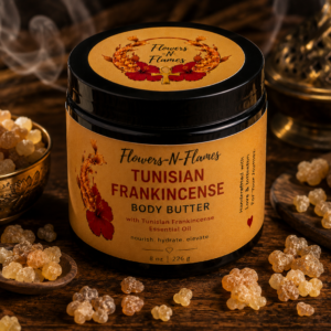 Flowers N Flames Tunisian Frankincense Body Butter in a black jar with a kraft label, handcrafted with shea butter, botanical oils, and Tunisian frankincense on a rustic wooden surface.
