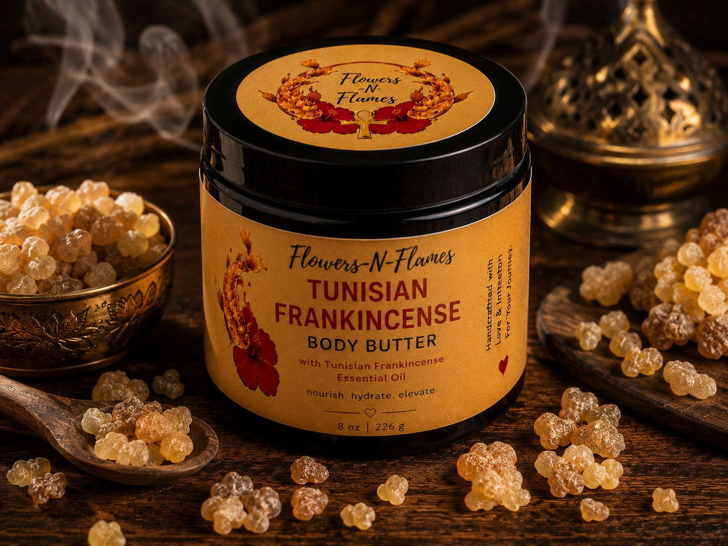 Flowers N Flames Tunisian Frankincense Body Butter in a black jar with a kraft label, handcrafted with shea butter, botanical oils, and Tunisian frankincense on a rustic wooden surface.