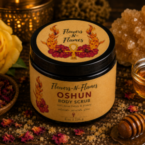 Flowers N Flames Oshun Body Scrub in a black jar with a kraft label, handcrafted with rose petals, honey, and botanical ingredients on a rustic wooden surface.