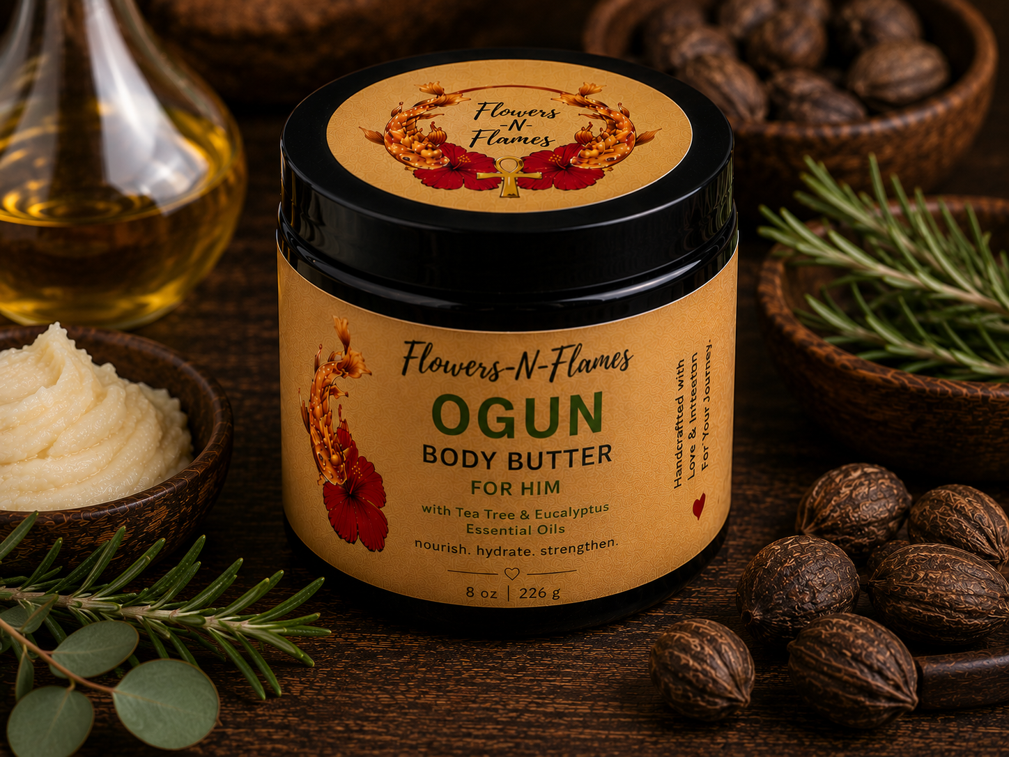Flowers N Flames Ogun Body Butter in a black jar with a kraft label, handcrafted with botanical butters, tea tree, eucalyptus, and rosemary on a rustic wooden surface.