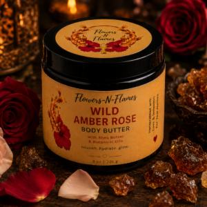 Flowers N Flames Wild Amber Rose Body Butter in a black jar with a kraft label, handcrafted with botanical butters, warm amber, and rose on a rustic wooden surface.