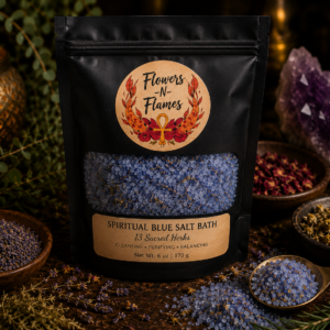 Flowers N Flames Spiritual Blue Salt Bath in a black pouch with a kraft label featuring botanical herbs, mineral salts, and blue bath crystals arranged on a rustic wooden surface.