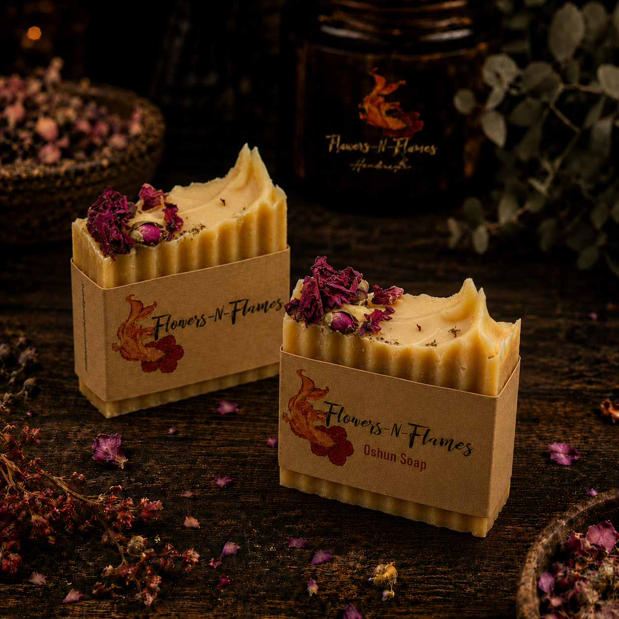Three handcrafted Flowers N Flames Goddess Oshun soap bars topped with dried rose petals and wrapped in brown labels.