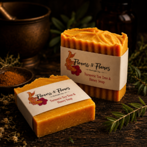 Handcrafted Flowers N Flames Tea Tree, Turmeric and Honey Soap with a golden color and botanical ingredients.